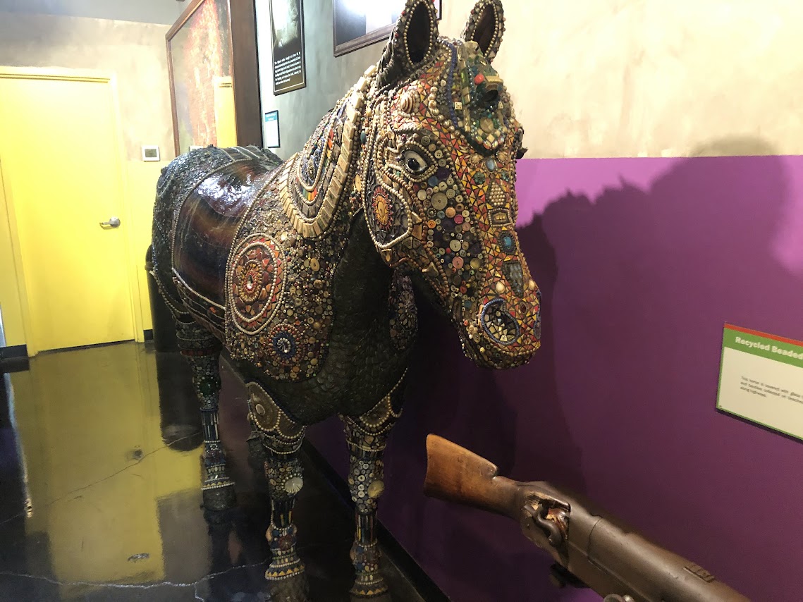 frightening horse made of junk and buttons
